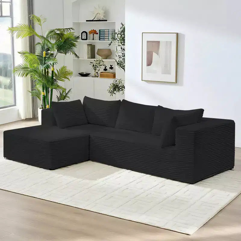 Divano componibile a L in velluto a coste oversize con chaise longue, design modulare, nero