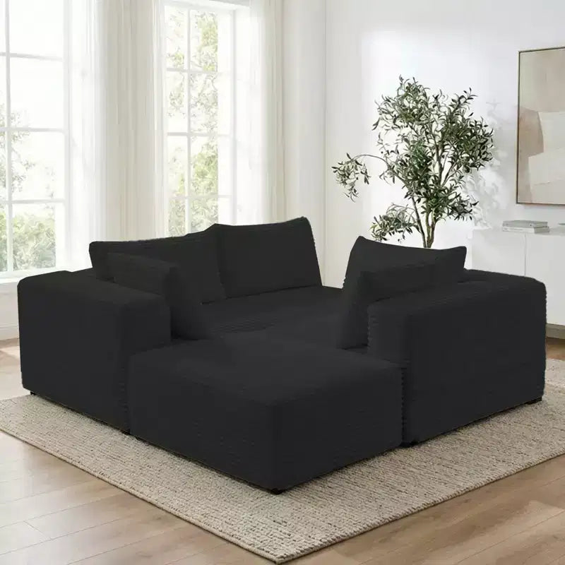 Divano componibile a L in velluto a coste oversize con chaise longue, design modulare, nero