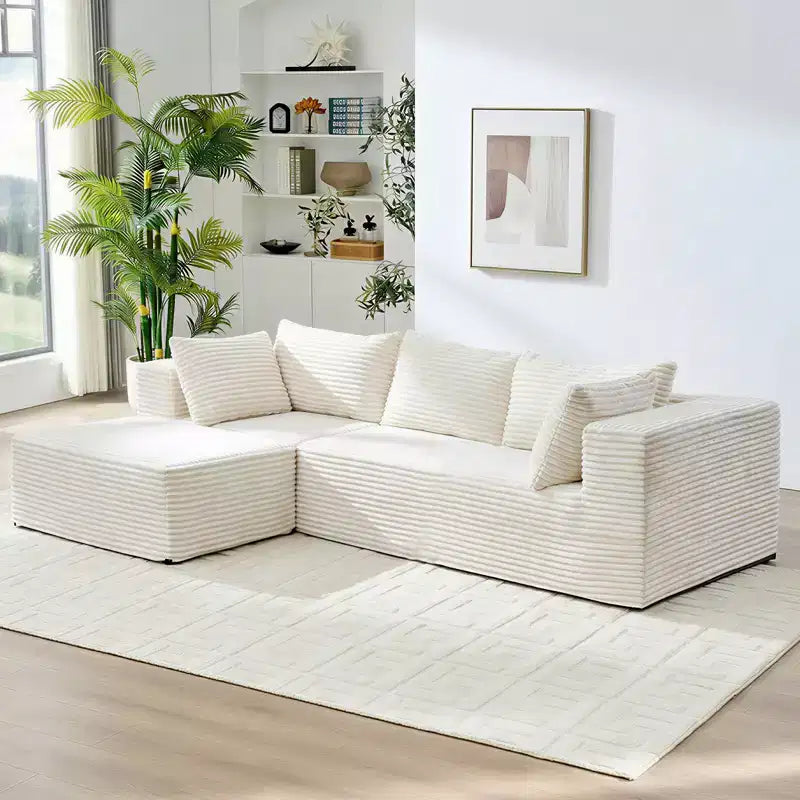 Divano componibile a L in velluto a coste oversize con chaise longue, design modulare, nero