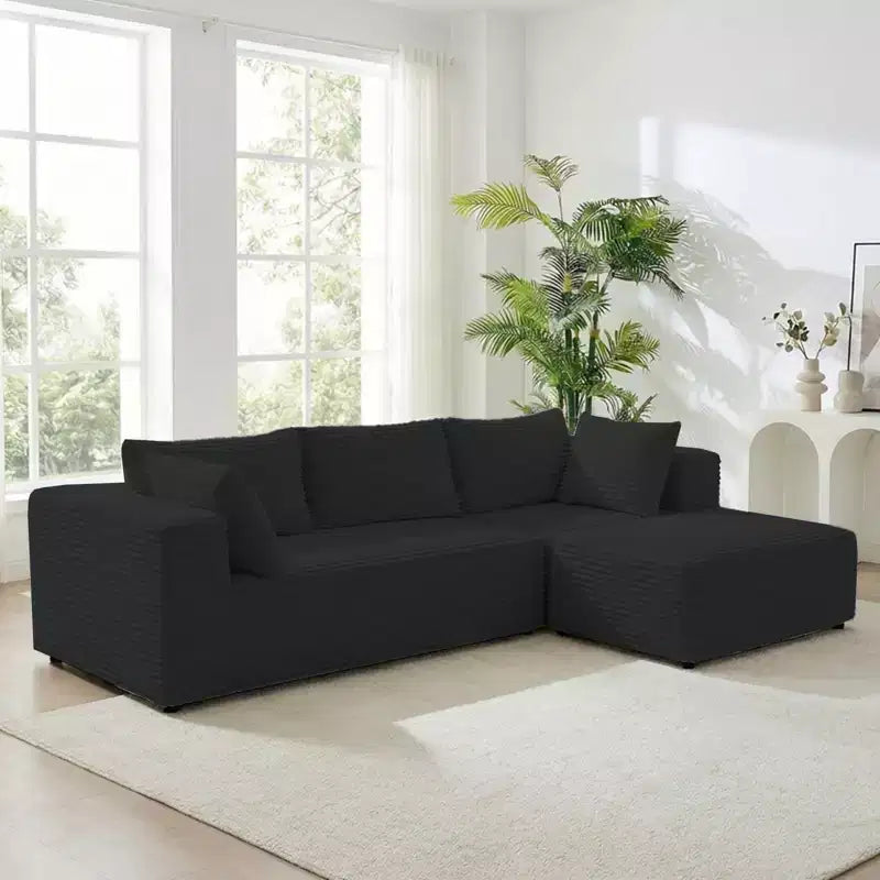 Divano componibile a L in velluto a coste oversize con chaise longue, design modulare, nero